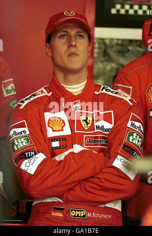 Michael Schumacher watches the times after setting the fastest time during Qualifying Stock Photo