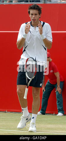 France's Nicolas Mahut reacts on the way to losing against USA's Andy Roddick, in the Artois Championships Final at The Queen's Club, London. Stock Photo
