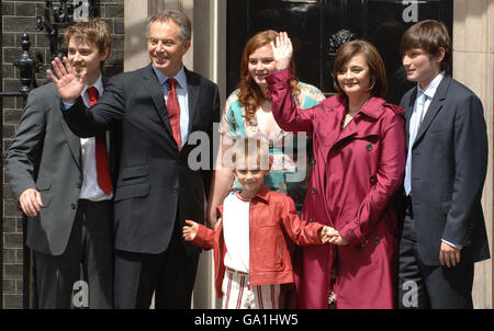Prime Minister Tony Blair accompanied by his family (left to right Euan, Kathryn, Cherie, Nicky and (Front row) Leo, pose on the steps of 10 Downing Street, London as Blair leaves for the last time. Stock Photo