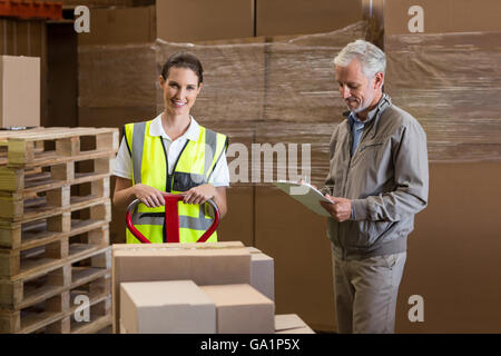 Smiling worker is posing next to her manager Stock Photo