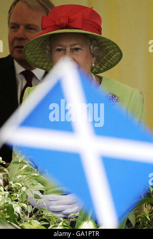 Britain's Queen Elizabeth II watches the riding procession during the ceremonial opening of the Scottish Parliament, in Edinburgh. Stock Photo