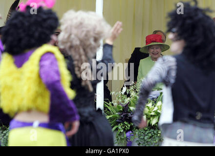 Britain's Queen Elizabeth II watches the riding procession during the ceremonial opening of the Scottish Parliament, in Edinburgh. Stock Photo