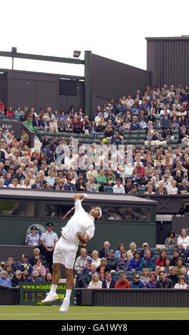 Switzerland's Roger Federer in action during The All England Lawn Tennis Championship at Wimbledon. Stock Photo