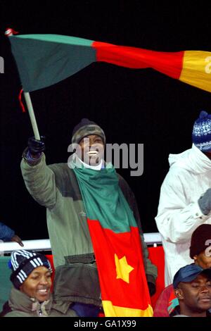 International Soccer - Friendly - Poland v Cameroon. A Cameroon fan flies the flag for his country Stock Photo