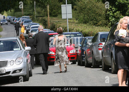 Guests arrive for the wedding of Cian Foley and Sue Ann McManus, daughter of racing tycoon JP McManus, at Martinstown Church, Co Limerick. Stock Photo