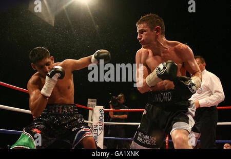 England's Amir Khan (left) and Scotland's Willie Limond in action during the Commonwealth Lightweight Title fight at the O2 Arena, London. Stock Photo