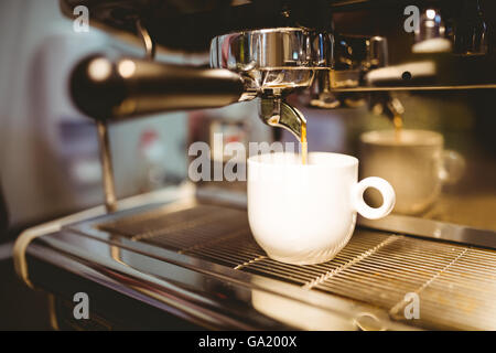 Coffee machine making a cup of coffee Stock Photo