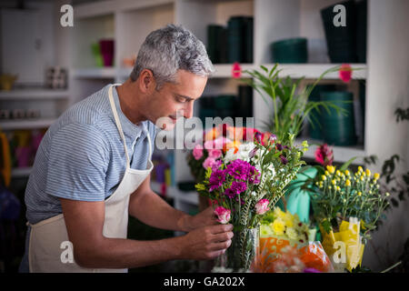 Florist preparing a flower bouquet Stock Photo