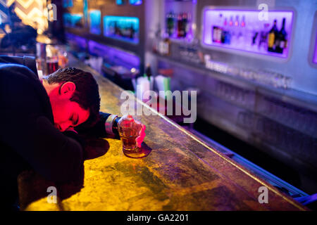 Drunken man sleeping on a bar counter Stock Photo: 109539749 - Alamy