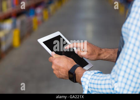 Close up of worker hands using a tablet Stock Photo