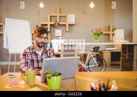 Graphic designer working on laptop Stock Photo