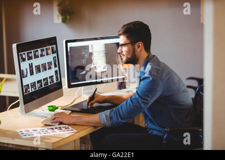 Graphic designer using a graphics tablet Stock Photo