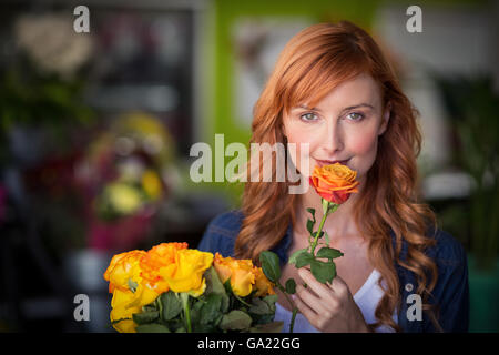 Portrait of female florist holding bunch of flowers Stock Photo - Alamy