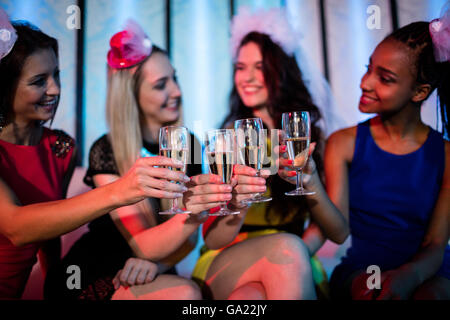 Group of smiling friend toasting glass of champagne Stock Photo