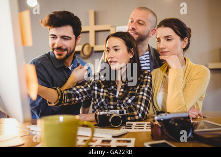 Team of graphic designers working on a computer Stock Photo