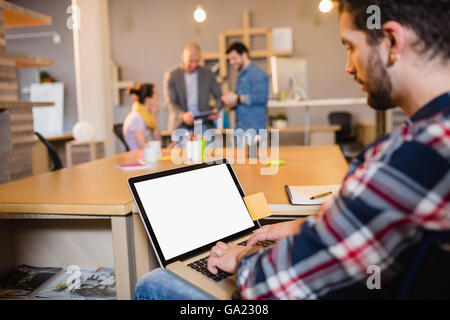 Graphic designer using laptop Stock Photo