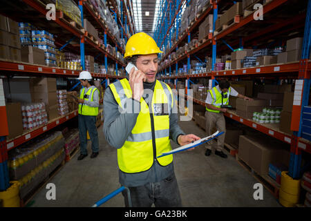 Worker using phone Stock Photo