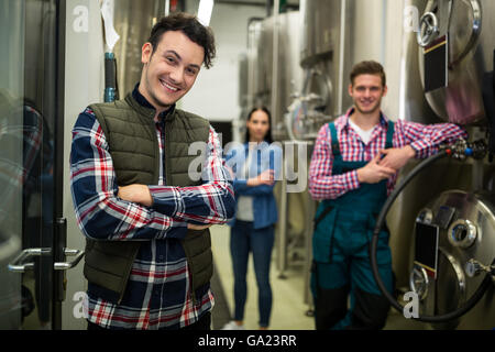 Brewers posing at brewery factory Stock Photo