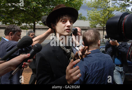 Singer Pete Doherty leaves West London Magistrates Court in London where he faced drugs charges minutes after a warrant was issued for his arrest. Stock Photo