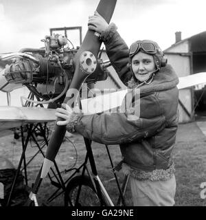 Joan Hughes, a test pilot and instructor at the Airways Flying Club, White Waltham, near Maidenhead, Berkshire, prepares to fly a Demoiselle monoplane which has been built, correct to the last detail, for a new 20th Century Fox picture, 'Those Magnificent Men in their Flying Machines'. Stock Photo