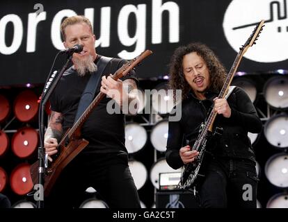 James Hetfield and Kirk Hammett (right) on stage during Metallica's performance at the charity concert at Wembley Stadium, London. Stock Photo