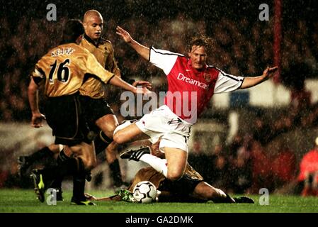 Soccer - FA Barclaycard Premiership - Arsenal v Manchester United. Manchester United's Laurent Blanc slides in on Arsenal's Ray Parlour Stock Photo