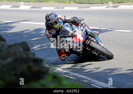 John McGuinness during the 2016 Superstock TT race on the Isle of Man on a Honda CBR1000RR on the approach to Ramsey Hairpin. Stock Photo