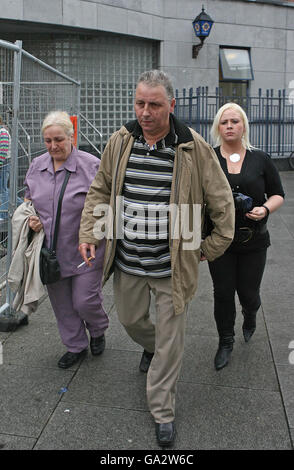 Larry and Esther Wheelock (right) pass Store Street Garda station on their way from inquest into the death of their son Terence, 20, at Dublin Coroners Court. Stock Photo