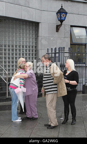The Wheelock family pass Store Street Garda station on their way from inquest into the death of their son Terence, 20, at Dublin Coroners Court. Stock Photo