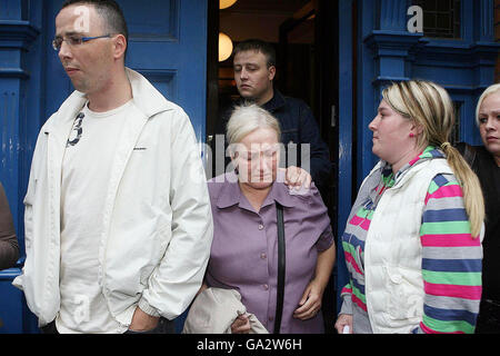 Esther Wheelock (centre) leaves Dublin Coroners Court during the inquest into the death of her son Terence, 20, who died after being found unconscious in a cell at Store Street Garda Station in Dublin last year. Stock Photo