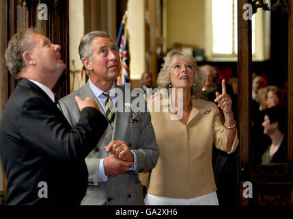 The Duchess of Cornwall and Prince Charles, the Prince of Wales, (centre) view the newly restored medieval ceiling of St. Nicholas church during a visit to the village of Bromham in Wiltshire. Stock Photo