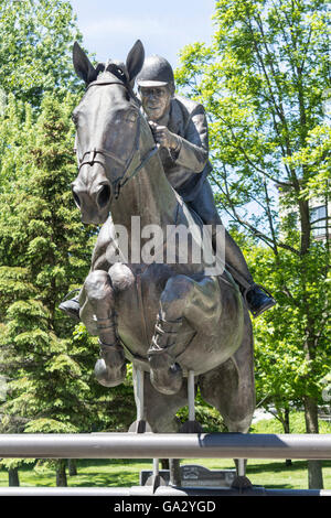 Bronze statue of Ian Millar and Big Ben in Stewart Park in Perth, Ontario, Canada Stock Photo