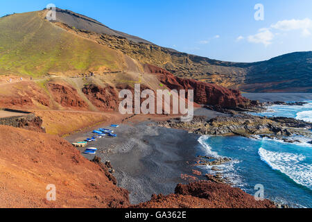 Beach with fishing boats on shore in El Golfo, Lanzarote, Canary Islands, Spain Stock Photo