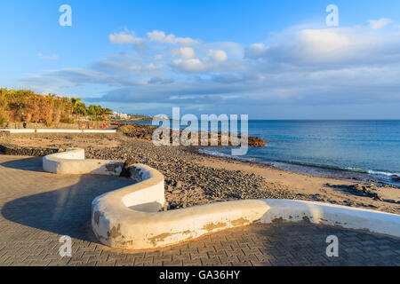Sunset on coastal promenade in Playa Blanca village, Lanzarote, Canary Islands, Spain Stock Photo