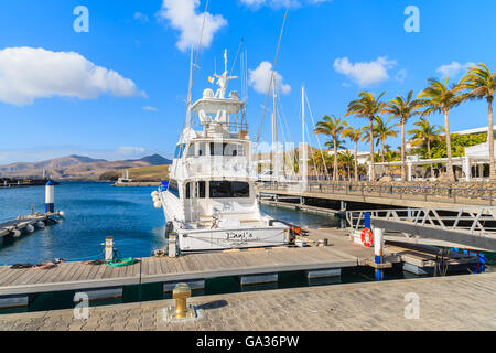 PUERTO CALERO MARINA, LANZAROTE ISLAND - JAN 17, 2015: luxury boat in port built in Caribbean style in Puerto Calero. Canary Islands are popular sailing destination. Stock Photo