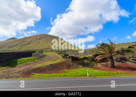 Road in mountain landscape of Lanzarote island near Yaiza, Canary Islands, Spain Stock Photo