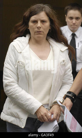 SCOTLAND Paedophiles 4. Caroline Dunsmore, 43 is lead away from Edinburgh High Court. Stock Photo