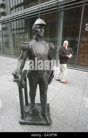 A passer by looks at a statue of Admiral William Brown, the Irish-born founder of the Argentine navy, at Sir John Rogerson Quay in Dublin. Stock Photo