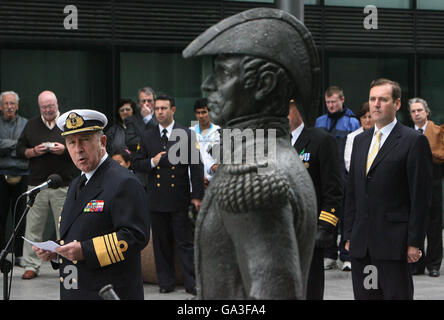 (R-L) Irish junior defence minister Tom Kitt and Argentinian Admiral Jorge Omar Goday behind a statue of Admiral William Brown at Sir John Rogerson Quay in Dublin. They were marking the 150th anniversary of the death of the Mayo-born Admiral William Brown, founder of the Argentine navy. Stock Photo