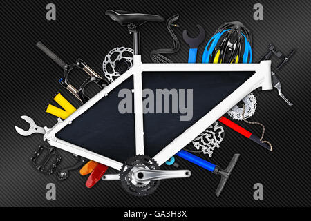 bicycle frame with parts and empty blackboard on carbon fibre background Stock Photo
