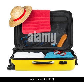 yellow open packed suitcase isolated on white background Stock Photo