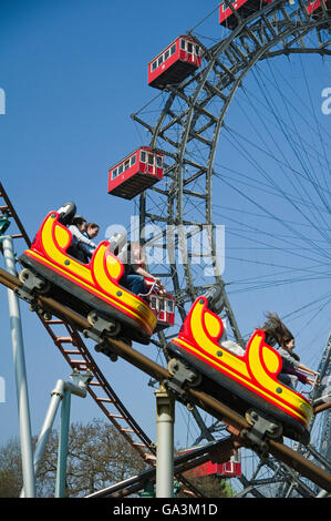 Roller coaster in front of the Ferris Wheel, Prater, Vienna, Austria, Europe Stock Photo