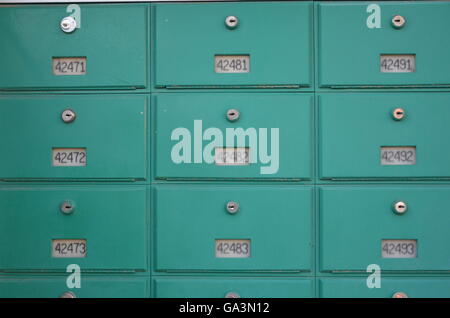 Numbered green pastel lock box wall savety safe deposit box locker lockbox Stock Photo