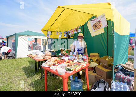 Traditional Russian dish plov being sold at a market outdoors in Russia Stock Photo
