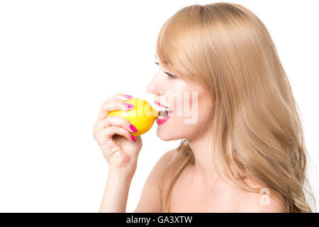 girl biting a lemon Stock Photo