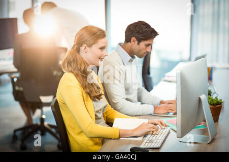 Executives working on laptop Stock Photo