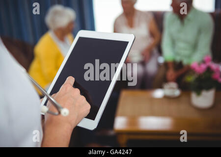 Close-up of a nurse holding a digital tablet Stock Photo