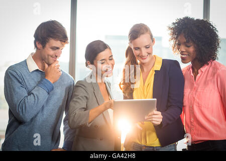 Business people discussing over digital tablet Stock Photo