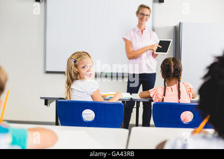 Teacher having lesson with tablet pc Stock Photo
