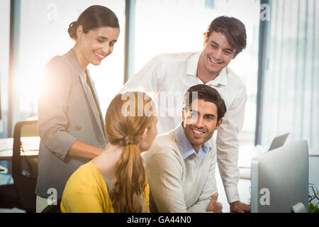 Business people having discussion with each other Stock Photo
